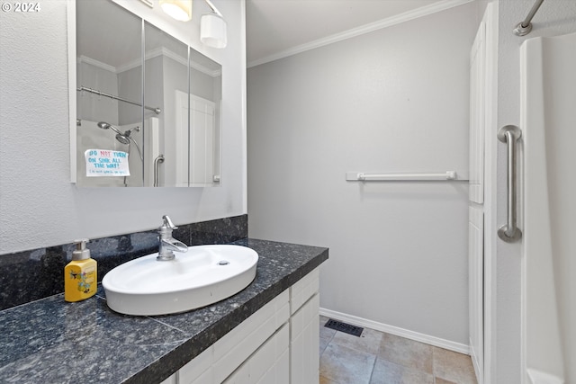 bathroom with a shower, crown molding, and vanity