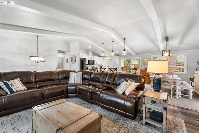 living room with dark hardwood / wood-style flooring and vaulted ceiling with beams