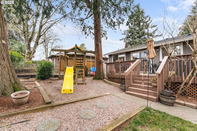 view of jungle gym featuring a wooden deck