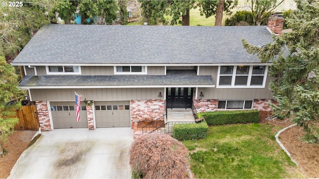 view of front facade featuring a garage and a front lawn