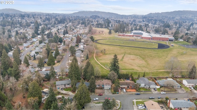 birds eye view of property with a mountain view