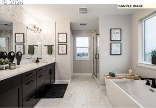 bathroom featuring shower with separate bathtub, vanity, and a wealth of natural light