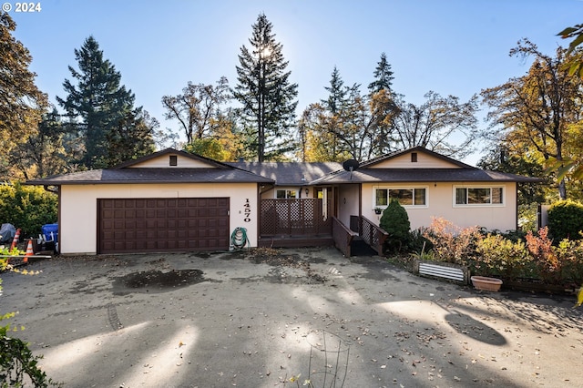 ranch-style house featuring a garage