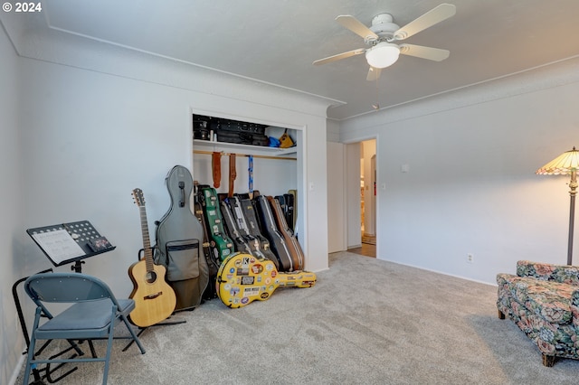 interior space with carpet and ceiling fan