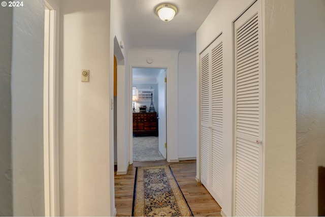 corridor featuring light wood-type flooring