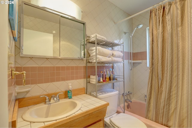 full bathroom featuring vanity, toilet, and shower / bathtub combination with curtain