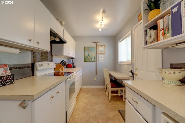 kitchen featuring rail lighting, extractor fan, white electric range, white cabinetry, and light tile patterned flooring