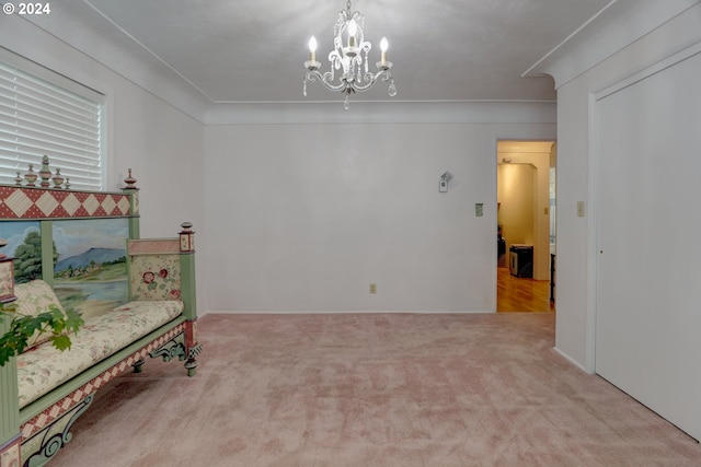 living area featuring light carpet and a notable chandelier