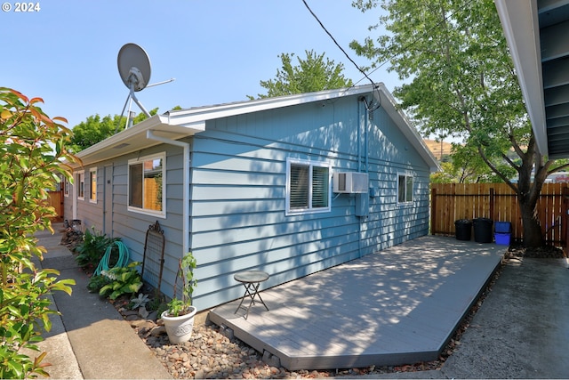 view of side of home with a patio area