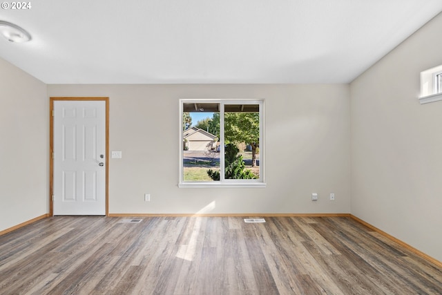 unfurnished room featuring hardwood / wood-style floors