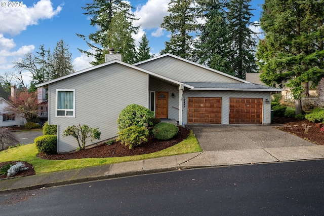 ranch-style house featuring a garage