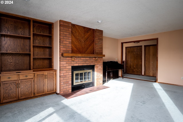 unfurnished living room featuring light carpet, a textured ceiling, and a fireplace