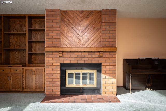 room details featuring carpet floors, a textured ceiling, and a brick fireplace