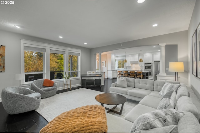 living room featuring ornate columns