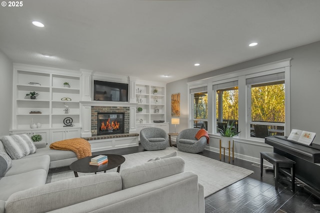 living room featuring a fireplace and dark hardwood / wood-style flooring