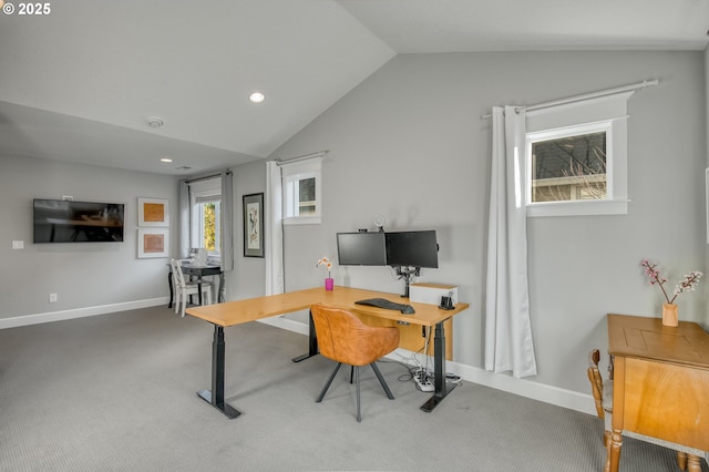 carpeted office featuring lofted ceiling