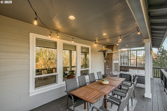 wooden terrace with an outdoor hangout area