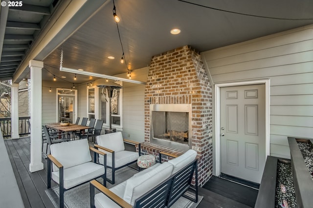 view of patio with outdoor lounge area and a deck