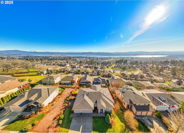 birds eye view of property featuring a mountain view