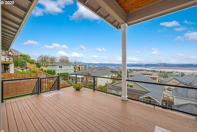 wooden deck featuring a residential view