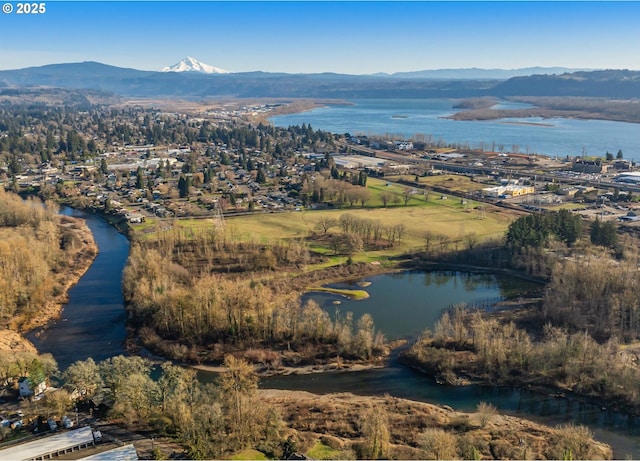 bird's eye view with a water and mountain view