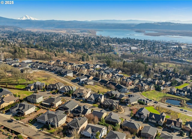 aerial view with a residential view and a water and mountain view