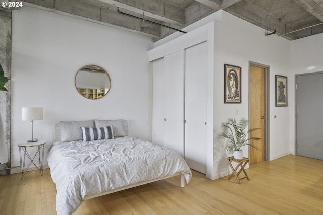 bedroom featuring a closet and hardwood / wood-style flooring