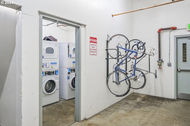 laundry area featuring stacked washer / dryer