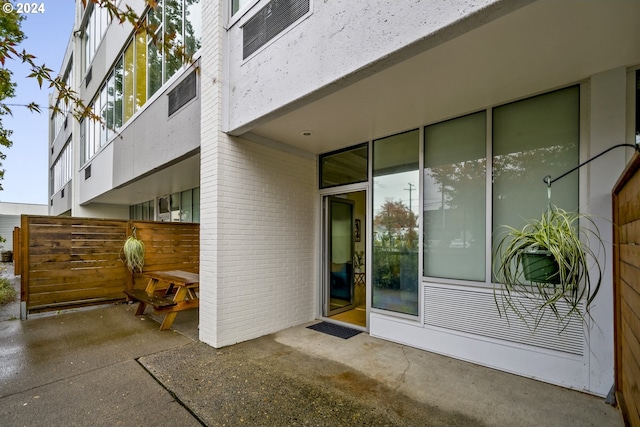 doorway to property with a patio