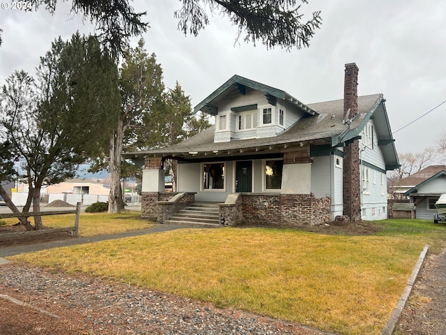 view of front of property with a front yard and a porch