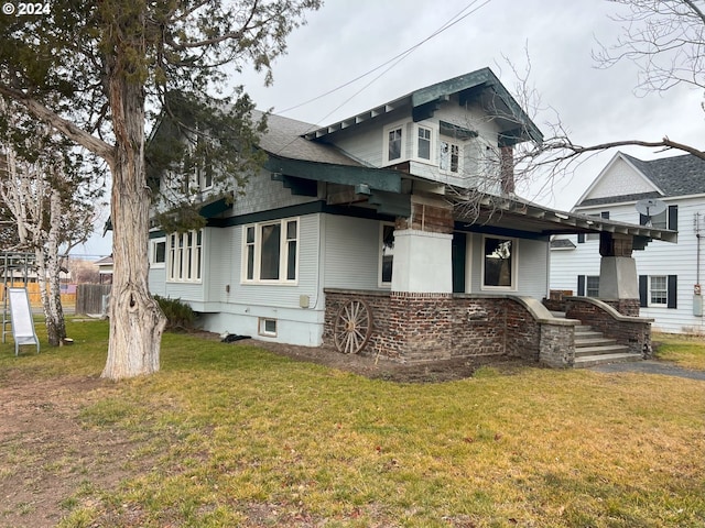 view of home's exterior featuring a yard