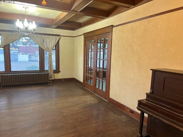 interior space featuring coffered ceiling, beamed ceiling, a notable chandelier, dark hardwood / wood-style flooring, and radiator heating unit