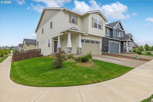 view of front of home featuring a front lawn and a garage