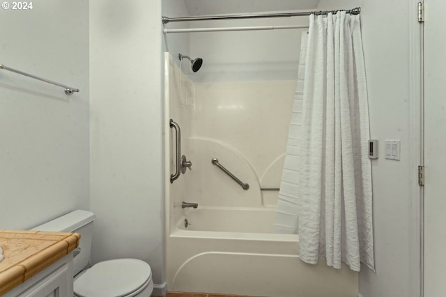 full bathroom featuring vanity, shower / tub combo, and toilet