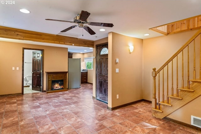 interior space featuring ceiling fan