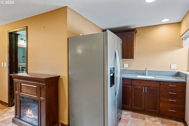 kitchen with stainless steel fridge and sink