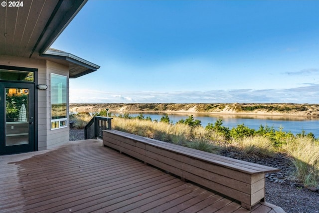 wooden deck with a water view