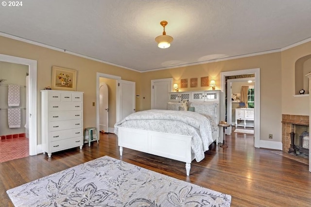 bedroom with ornamental molding and dark hardwood / wood-style flooring