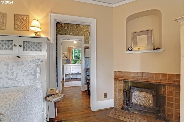 interior space with crown molding and dark hardwood / wood-style floors