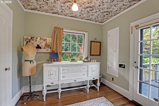 interior space with dark wood-type flooring, brick ceiling, and ornamental molding