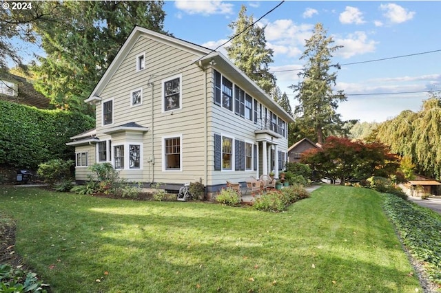 view of side of home featuring a yard