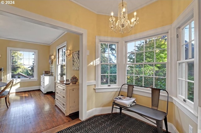 sunroom / solarium with a notable chandelier