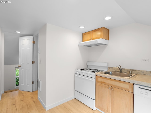 kitchen with sink, light hardwood / wood-style flooring, vaulted ceiling, white appliances, and light brown cabinetry