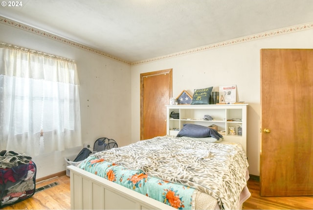 bedroom featuring light hardwood / wood-style floors