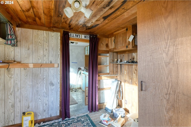 interior space with wooden ceiling and wooden walls