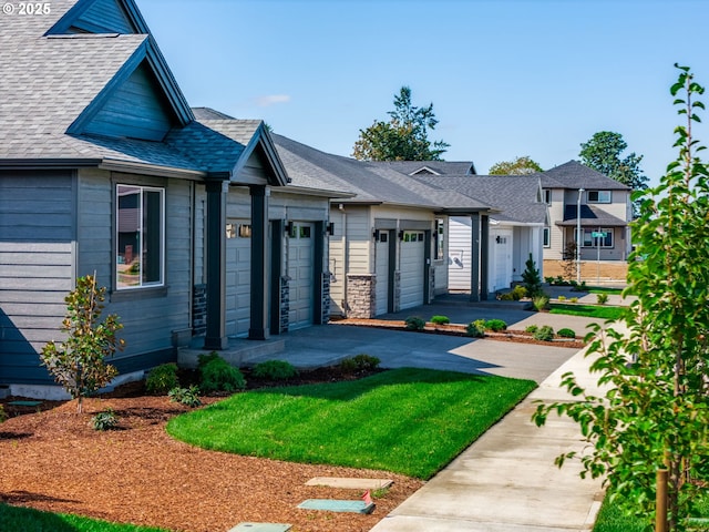 view of front facade featuring a garage and a front lawn