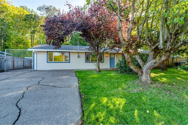 single story home with a front yard