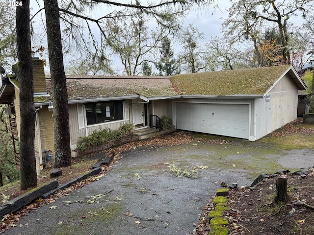 single story home with a garage