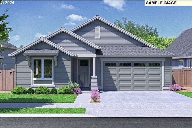 view of front of house with a front yard and a garage