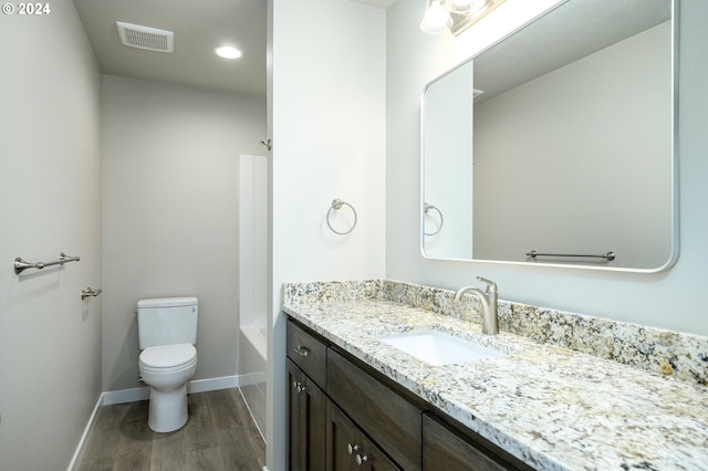 full bathroom with vanity, toilet, shower / bathtub combination, and hardwood / wood-style flooring